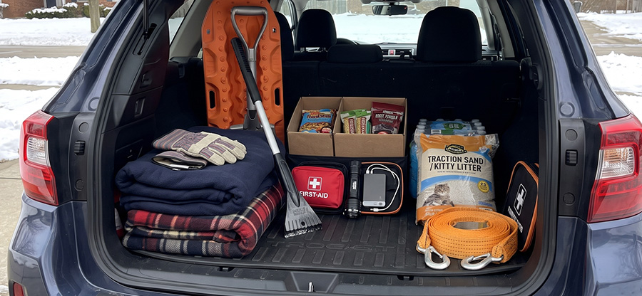 Trunk with necessary items for driving in snow